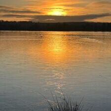 Sun rise reflected over lake